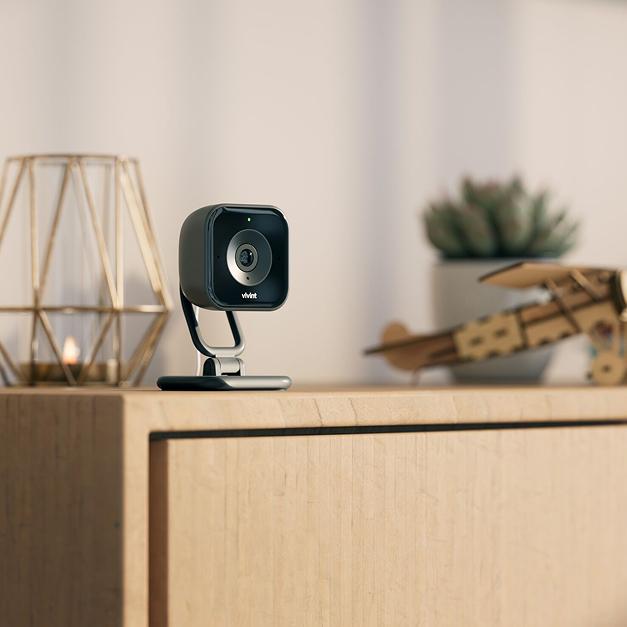 Modern Indoor Security Camera Displayed on Shelf in Residential Interior